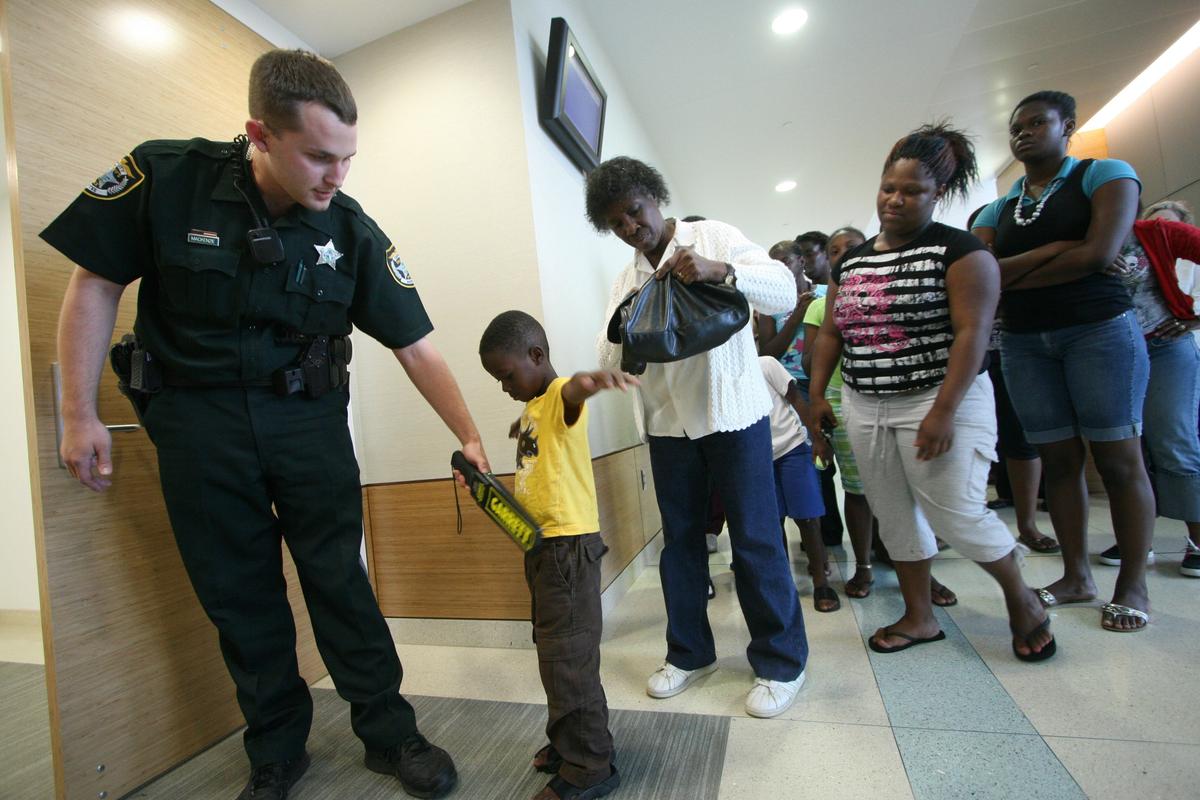 Manatee County Sheriff’s deputies search everyone entering the courtroom prior to the reading of the verdict convicting Orlando Valenzuela of 2nd degree murder at the end of Valenzuela’s trial for the murder of 9 year-old Stacy Williams III at the Manatee County Courthouse in Bradenton.