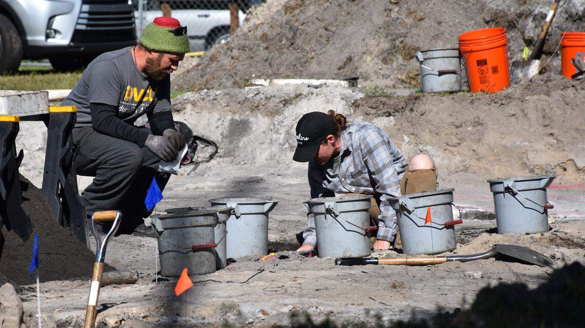 A group of researchers and volunteers assisted in the excavation of the Manatee Mineral Springs Park by gently shoveling dirt into buckets and running it through sifters to uncover hidden artifacts like buttons, marbles and toothbrushes that reveal the lifestyle of Angolan settlers in the early 19th century.