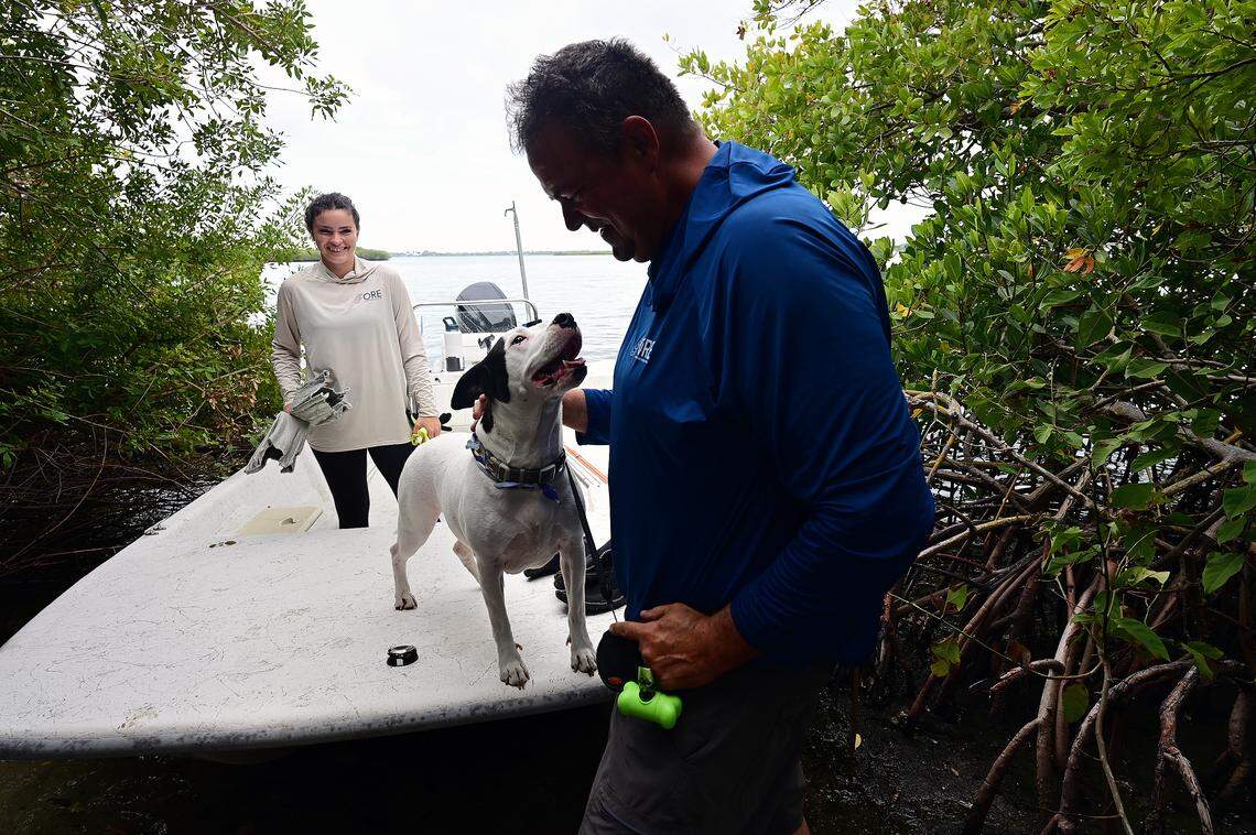 Damon Moore, founder and executive director of Oyster River Ecology, with Abbey Kuhn, ecological project coordinator and Maisey the dog on the Manatee River on Feb. 27, 2026.