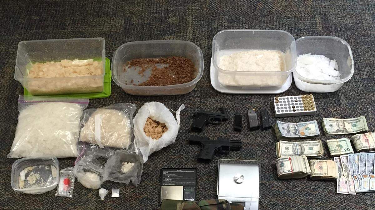 A Bradenton man has been charged with holding a large quantity of methamphetamine after narcotics, guns and $9,000 were seized at 11:50 a.m. Saturday from his home, according to the Manatee County Sheriff's Office.