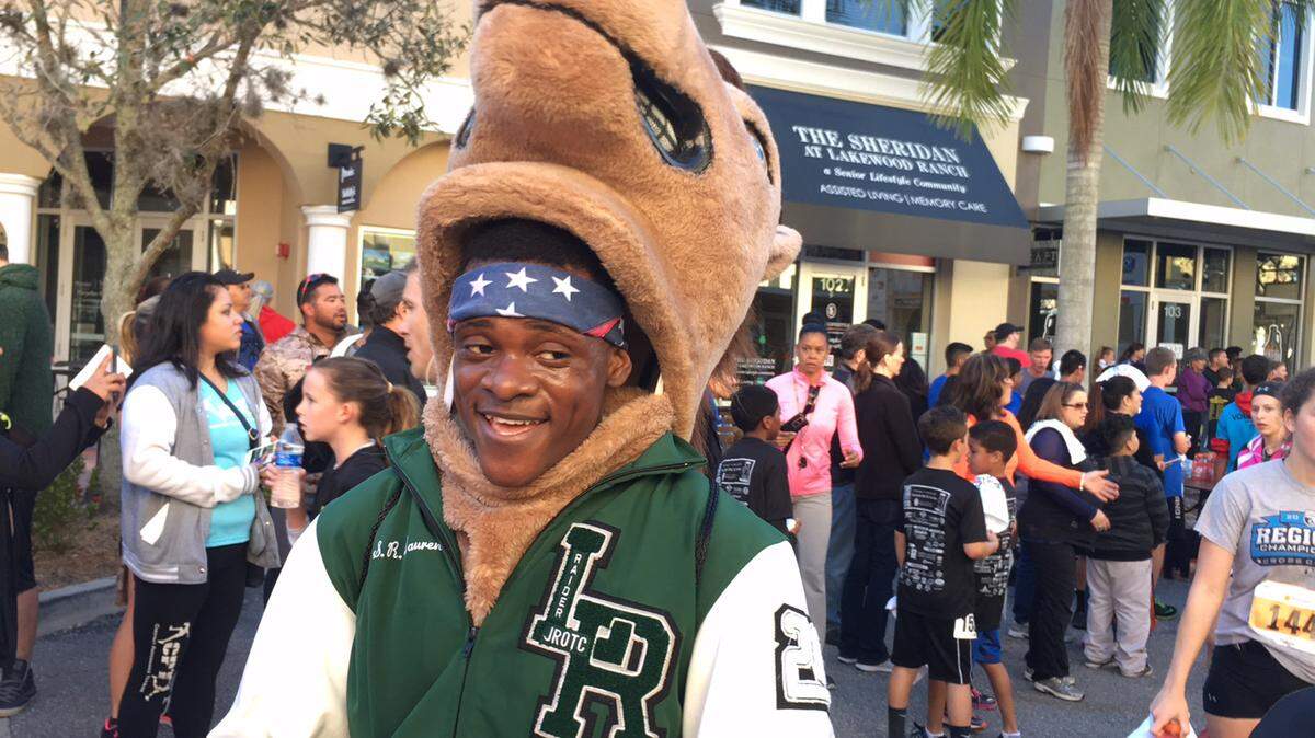 Lentz S.R. Laurent, the Lakewood Ranch High student mascot, was breathing a little heavy moments after he ran the 5K race is 29 minutes, 20 seconds during Sunday's Take Stock in Children races. That's not bad for running while wearing a heavy Mustang head.