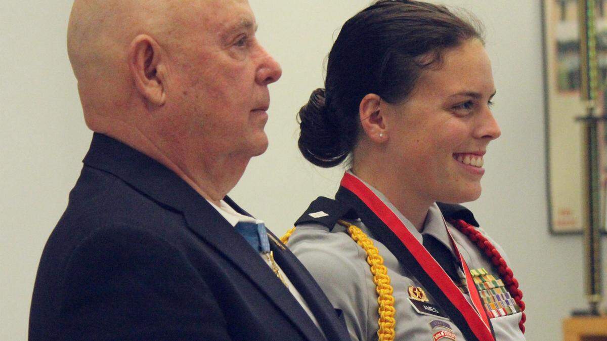 Retired Command Sergeant Major Gary Littrell, a Medal of Honor recipient, is shown with Palmetto High School Junior ROTC cadet Rachel Ames. 
 JAMES A. JONES JR./Bradenton Herald