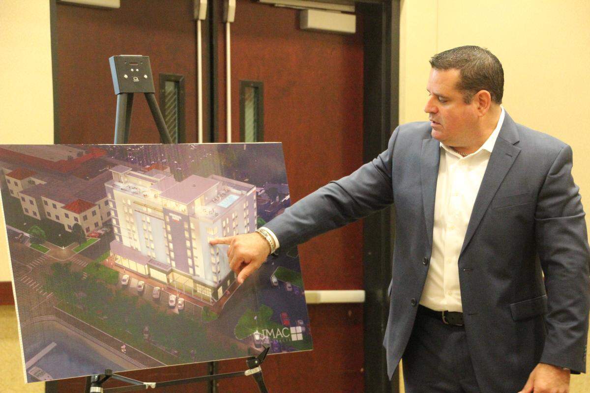 David Cocco, CEO of North Star Lodging and development, points out features of The Springhill Suites Downtown Bradenton Riverfront hotel, which is scheduled to open this December.