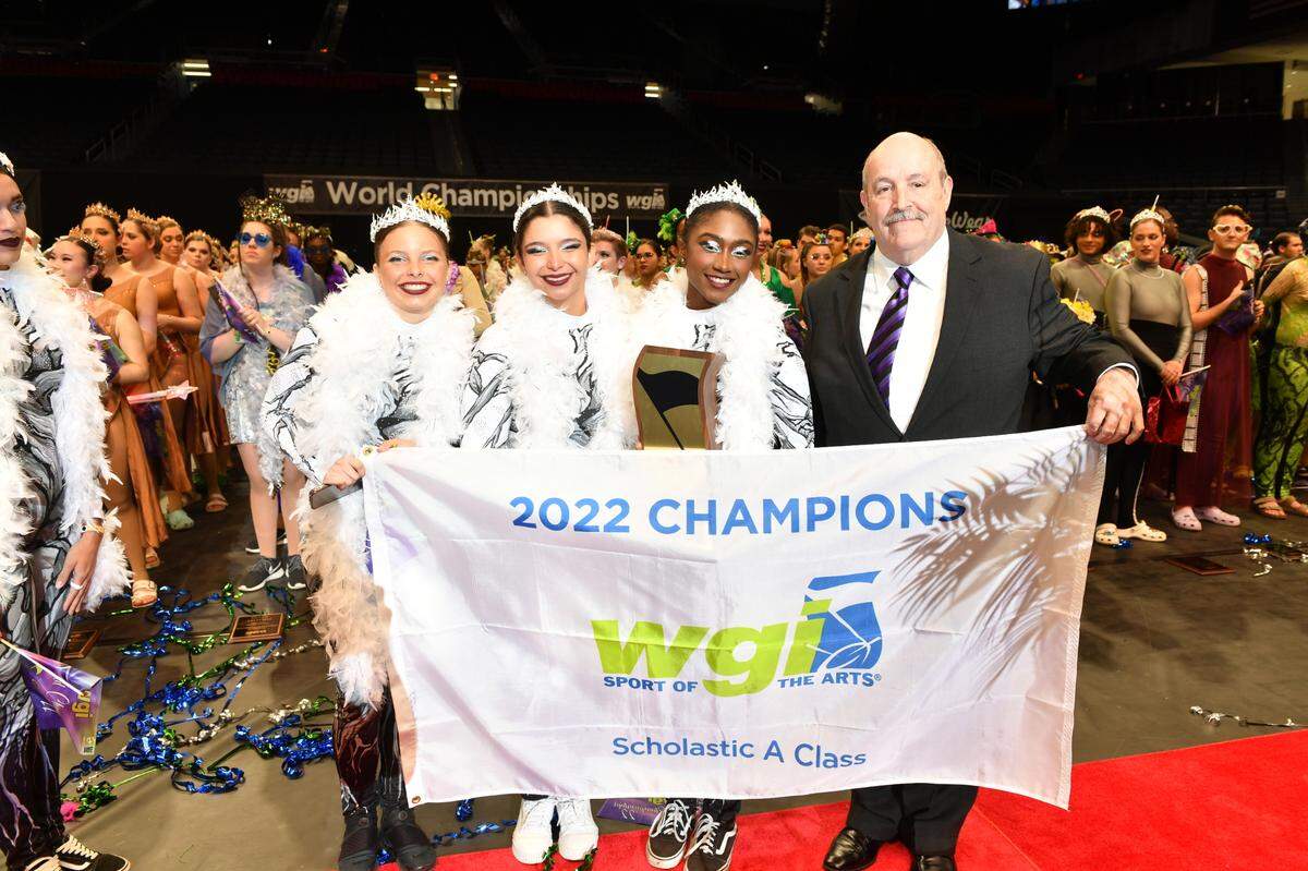 Members of Somerset Academy in Miami hold their first place banner at Winter Guard International World Championships in Dayton, Ohio on April 9, 2021.