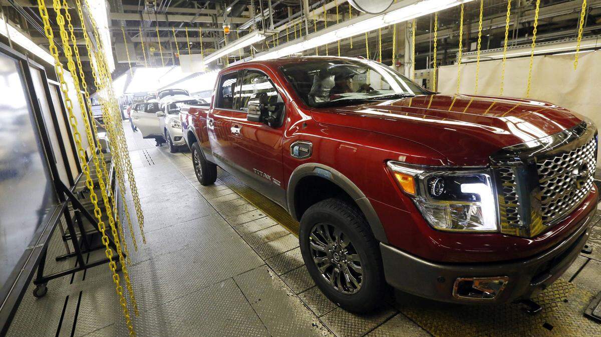 In this April 6, 2016, photo, a newly completed Titan rolls off the line at the Nissan Canton Vehicle Assembly Plant in Canton, Miss. Americaís love of trucks and SUVs helped push most automakers to healthy sales gains in April 2016 as Honda and Nissan reported best-ever April sales. Ford posted record SUV sales, while Toyota broke a record for SUV and truck sales. (AP Photo/Rogelio V. Solis)