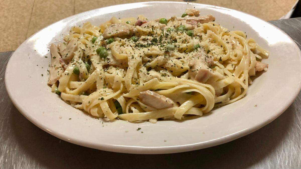 12/01/2021--Ryan and Erin Wilder operate Wilder’s Pizza at 827 14th St. W., Bradenton, offering pasta dishes and New York-style pizza. Shown above is the Fettuccini Carbonara.