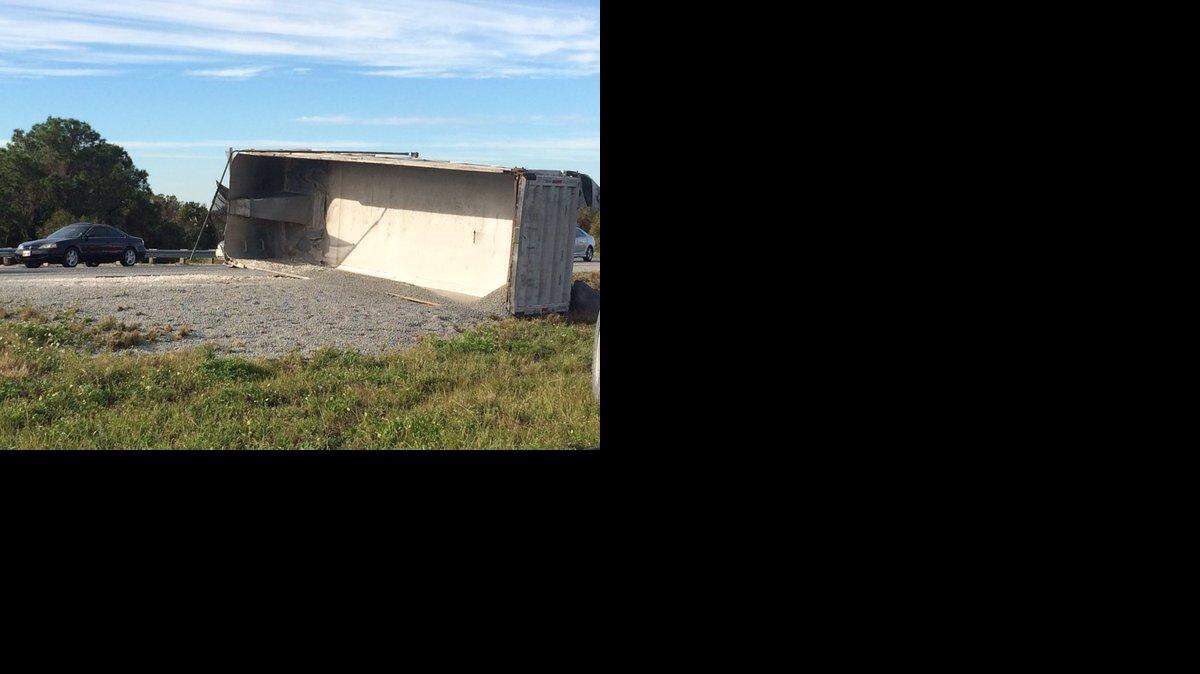 A tractor trailer spilled its load Tuesday, after it overturned on Interstate 75 at State Road 70 on Tuesday afternoon. AMARIS CASTILLO/Bradenton Herald