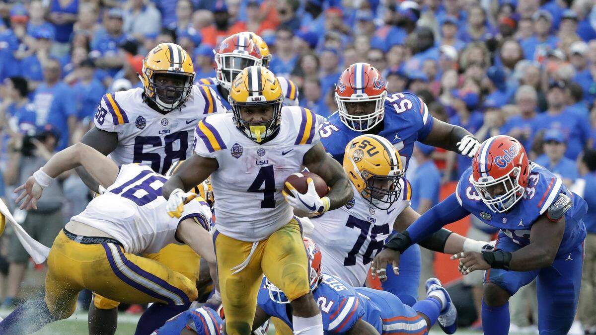 LSU running back Nick Brossette (4) runs past the Florida defense during the second half of an NCAA college football game, Saturday, Oct. 6, 2018, in Gainesville, Fla.