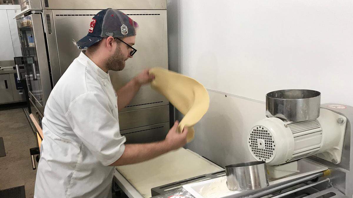 Andy Westberry prepares dough for Arepas Rolitas at Sugar Cubed Bakery in downtown Bradenton.