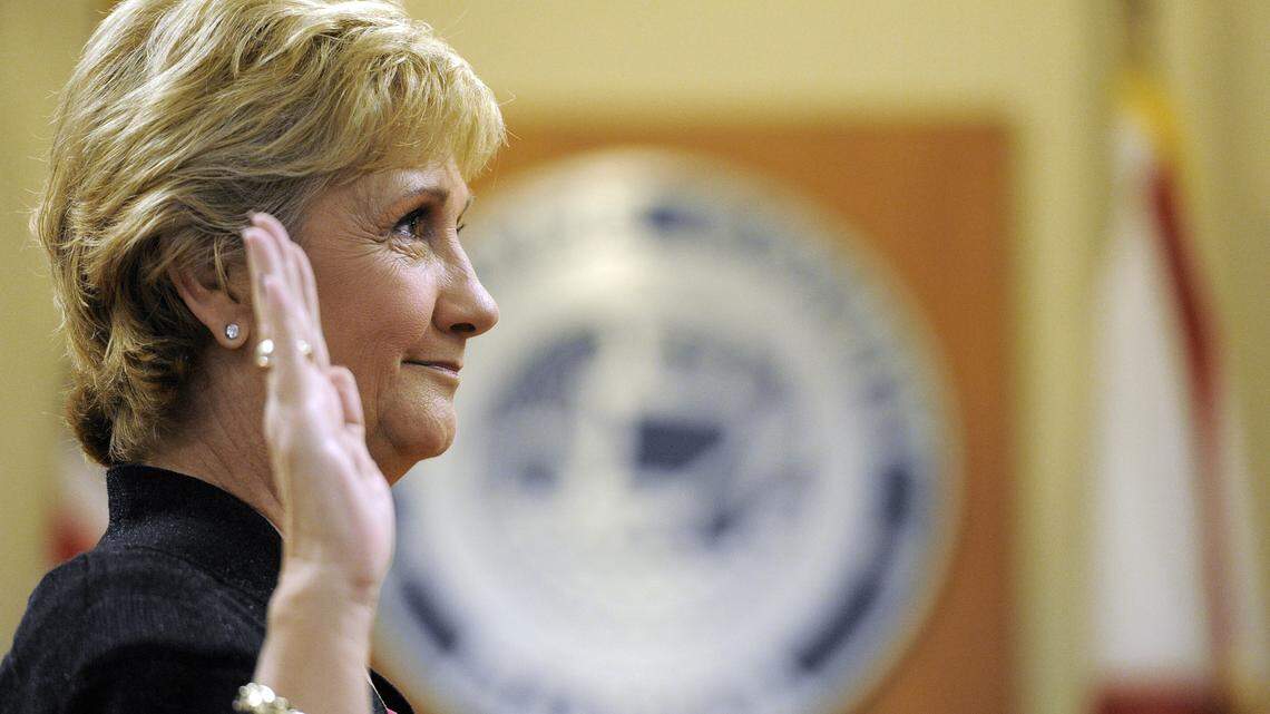 Vanessa Baugh holds up her hand as she is officially sworn in as Manatee County Commissioner for District 5, the office formerly held by Donna Hayes.