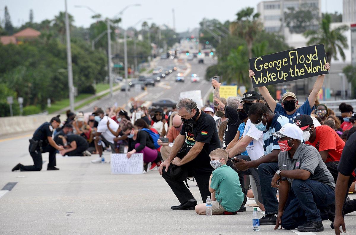 During a march called One Love, One Nation, One Heart, marchers took a knee on the pinnacle of the Green Bridge in remembrance of George Floyd. The group of about 200 made their way from Bradenton to Palmetto where they had speeches for racial justice and music.