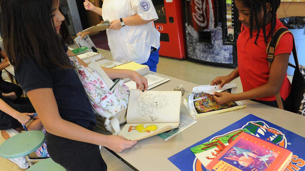 Malia Peltier and Aviona Woods work on homework at the Just for Girls West Bradenton Leadership Center at 3809 59th Street West. Just for Girls is hoping to receive donations through the global Giving Tuesday project to help fund the construction of a new $7 million at the 59th street west site. 
 GRANT JEFFERIES/Bradenton Herald