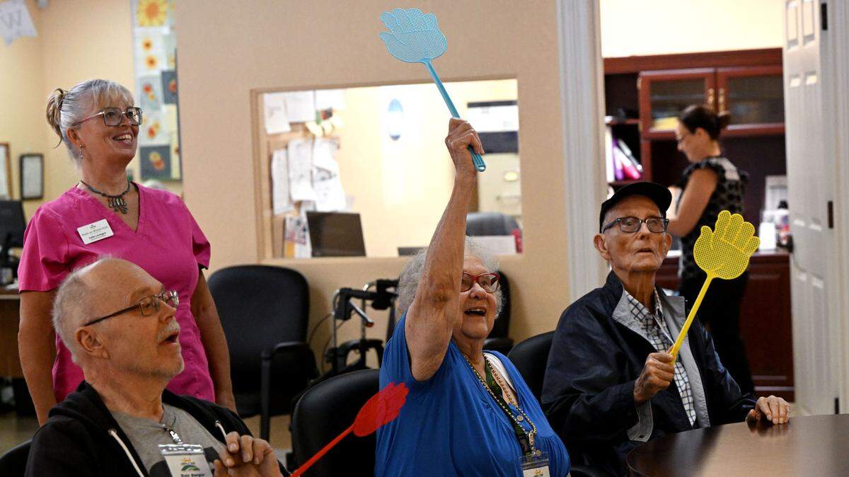 Seniors at the Daybreak Adult Day Center 10920 SR 70 E, Bradenton enjoy games of hot potato and table balloon tennis on June 26, 2024.