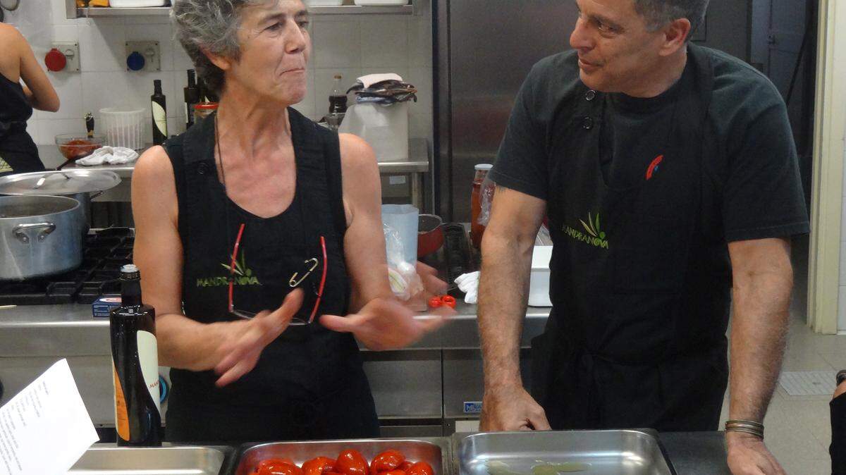 Sylvia, the owner of Villa Mandranova in Sicily, shows Chef Guy Canatta who she prepares stuffed roma tomatoes. 
 PROVIDED PHOTO
