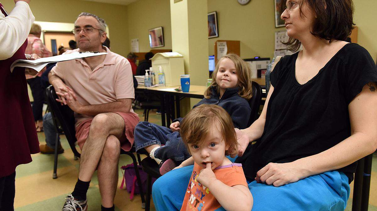 Nadia, 18 mos, with her family Laurence K., Kira, 5, and mother, Andrea S. participate in a homeless census at Turning Points on Bradenton. The family was there to find housing, as they have been living out of their van with the exception of Sunday night, when they said they were fortunate enough to be able to afford a night at a Days Inn. 
 TIFFANY TOMPKINS-CONDIE/Bradenton Herald