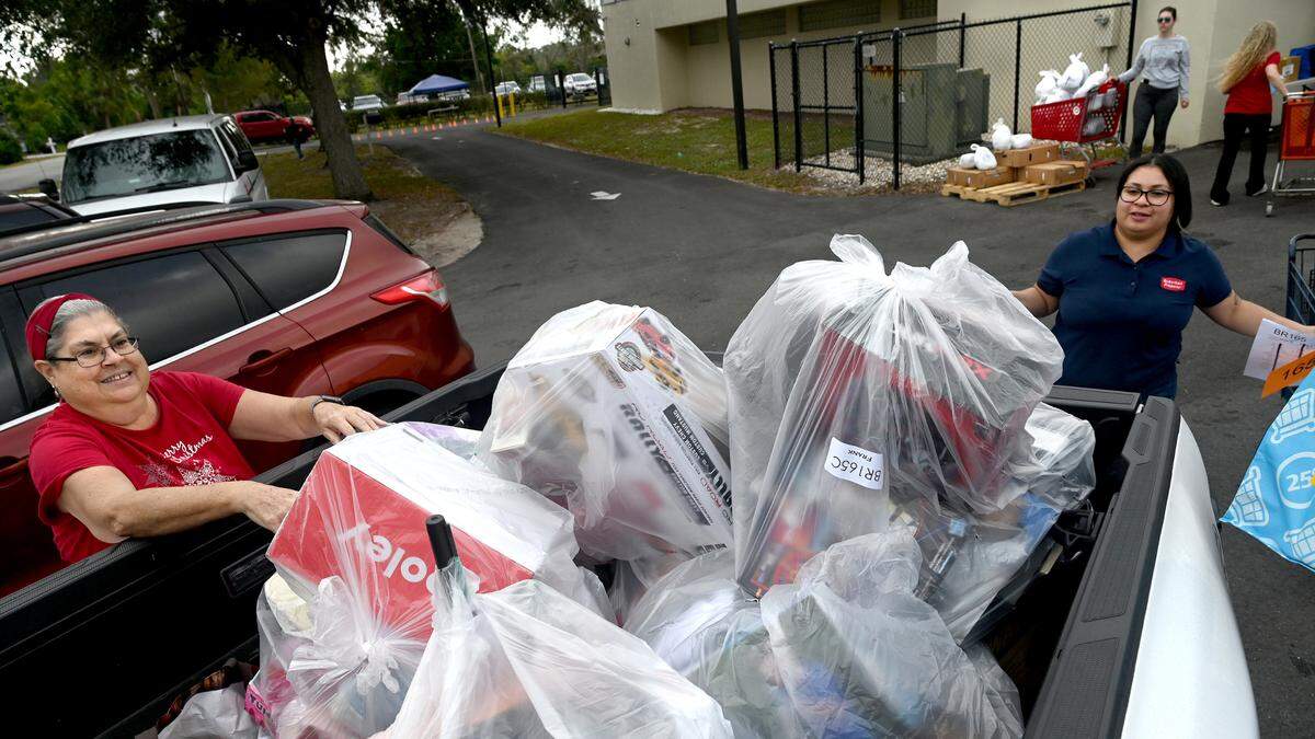 Over 30 volunteers gathered at the Salvation Army at 5328 24th St. E. in Bradenton to distribute Christmas gifts and turkeys to the families of 1,100 children through the Angel Tree program.