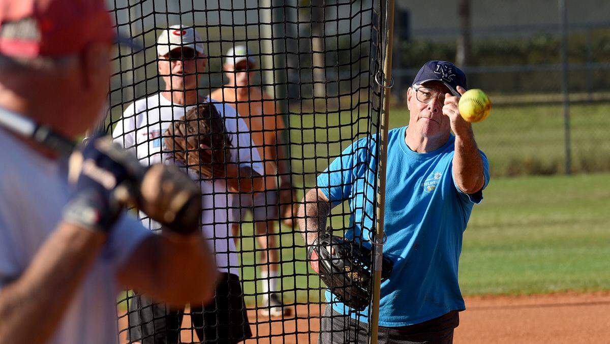 Marc During, a member of the Bradenton Senior Softball League, throws a pitch Thursday morning at G.T. Bray Park in Bradenton.