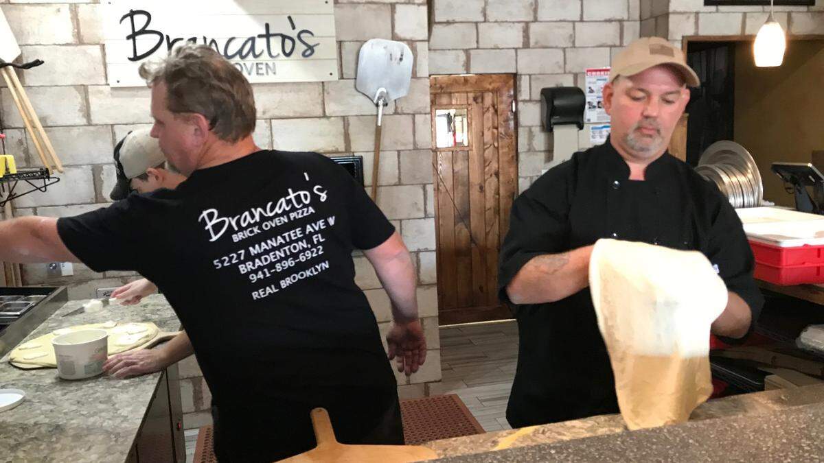 1/1/2019--Handling the lunchtime rush in a file photo from two years ago are pizza maker Jon Ellsworth, left, Paul Halvorsen, center, and Alex Christianson at Brancato’s Brick Oven Pizza, 5227 Manatee Ave. W., Bradenton.