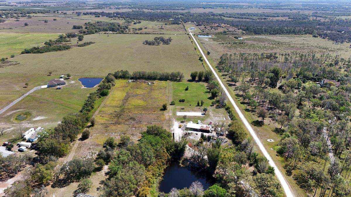 Manatee County is seeking the state’s help to conserve 550 acres of land in Myakka that could form a key link in the Florida Wildlife Corridor. Part of the land they are looking at is past the tree line midway in this photo taken March 13, 2025.