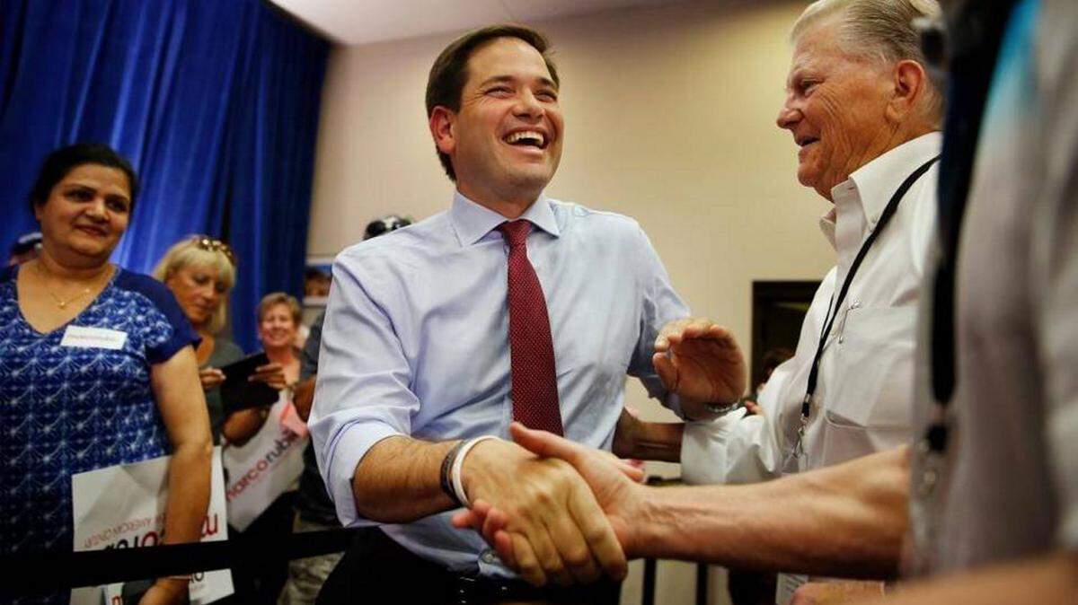 Rep ublican presidential candidate Marco Rubio shakes hands at a campaign event Thursday in Las Vegas. 
 JOHN LOCHER/ Associated Press