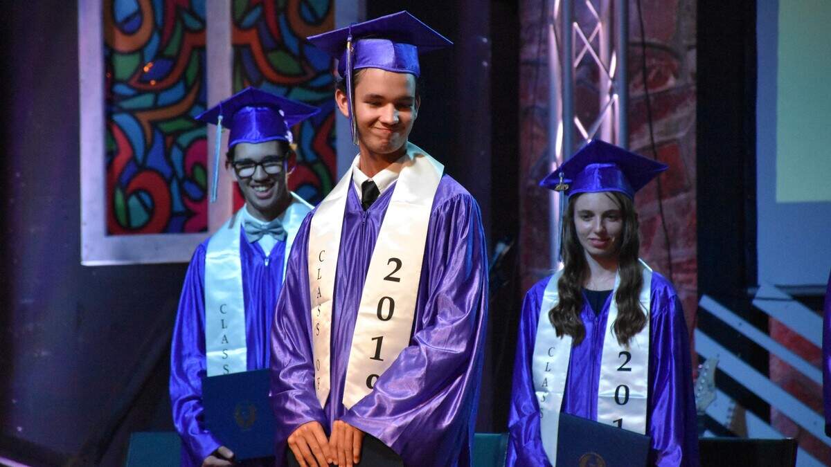 Hunter Butler, who was homeschooled his entire life, prepares to leave the stage at the Support Homeschool Activities Reaching Everyone (SHARE) Class of 2019 graduation ceremony Friday night.