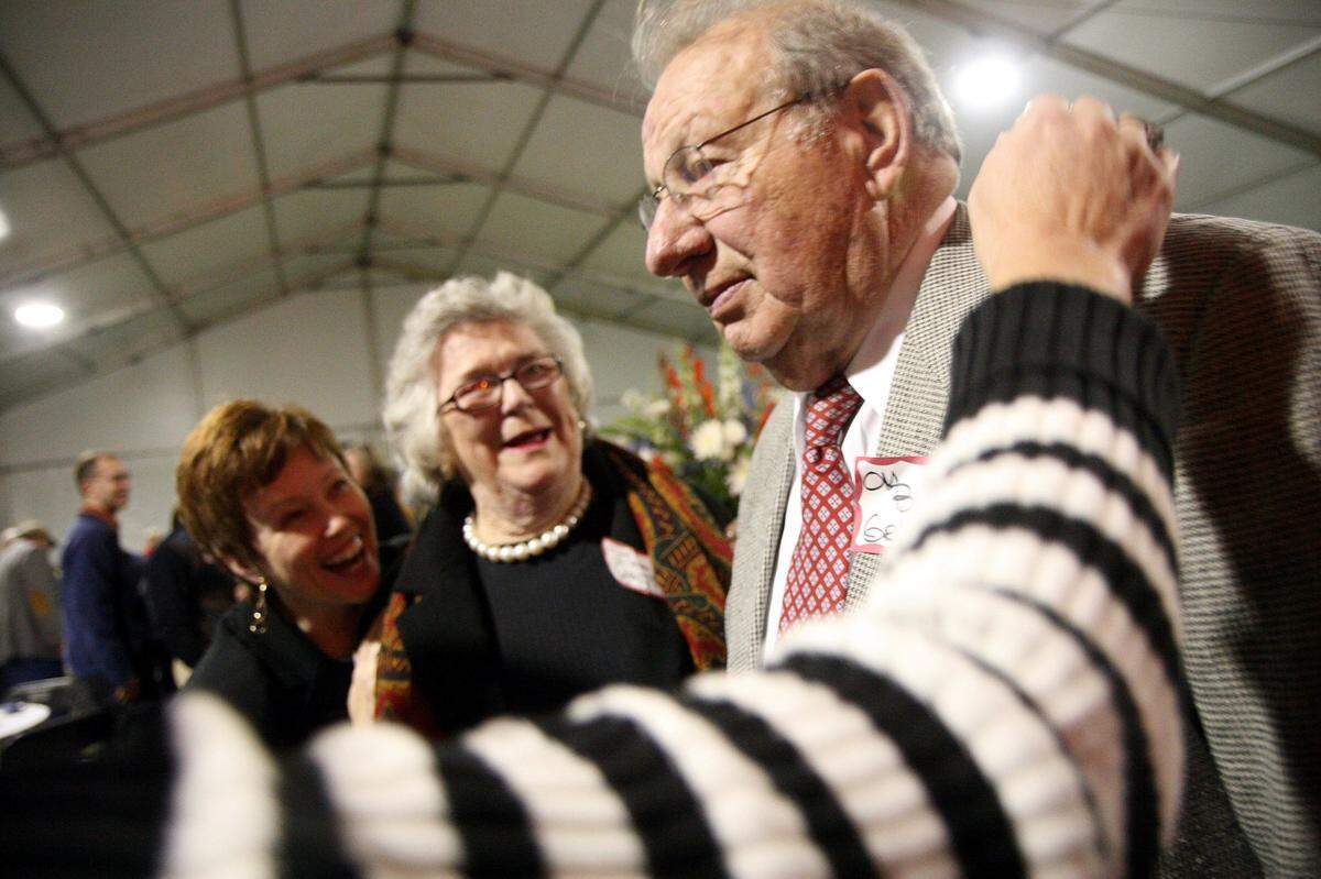 11/6/2008--Accompanied by his wife, Eileen, center, O.M. “Buster” Griffith was showered with congratulations from friends, including Bradenton City Councilwoman Marianne Barnebey, left, after being named the Manatee River Fair Association’s Distinguished Citizen in 2008.
