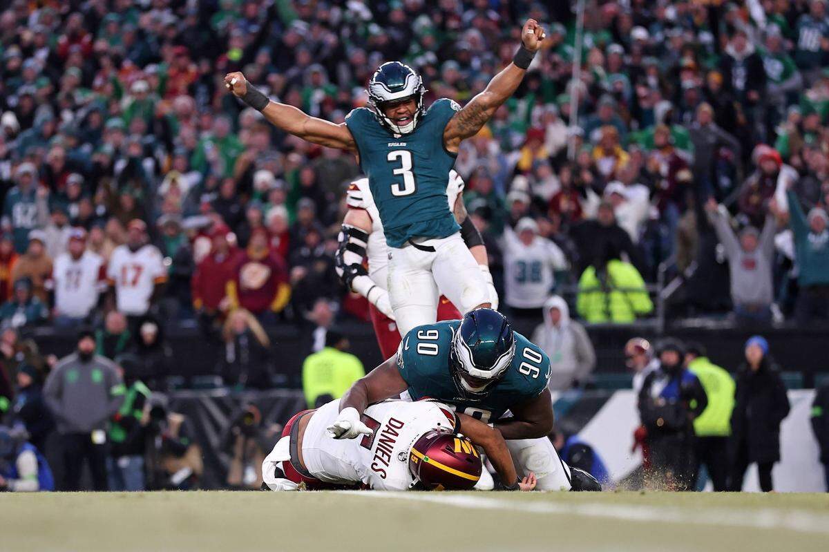 Jan 26, 2025; Philadelphia, PA, USA; Philadelphia Eagles linebacker Nolan Smith Jr. (3) celebrates as defensive tackle Jordan Davis (90) sacks Washington Commanders quarterback Jayden Daniels (5) during the second half in the NFC Championship game at Lincoln Financial Field. Mandatory Credit: Bill Streicher-Imagn Images