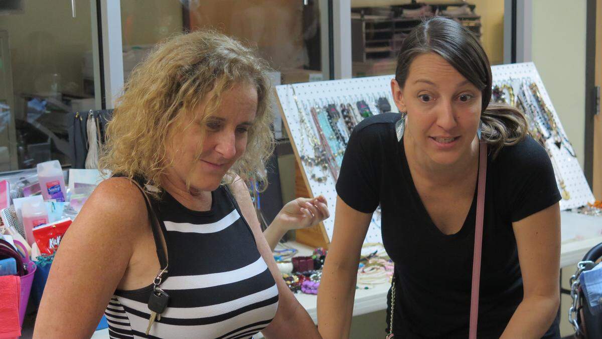 Laura Locoski (left), who represents Facing Homelessness Bradenton and runs the Pampering and Empowering program, looks on over the makeover process. Jeni Scheid (right) has been helping her plan for the event for about a year.