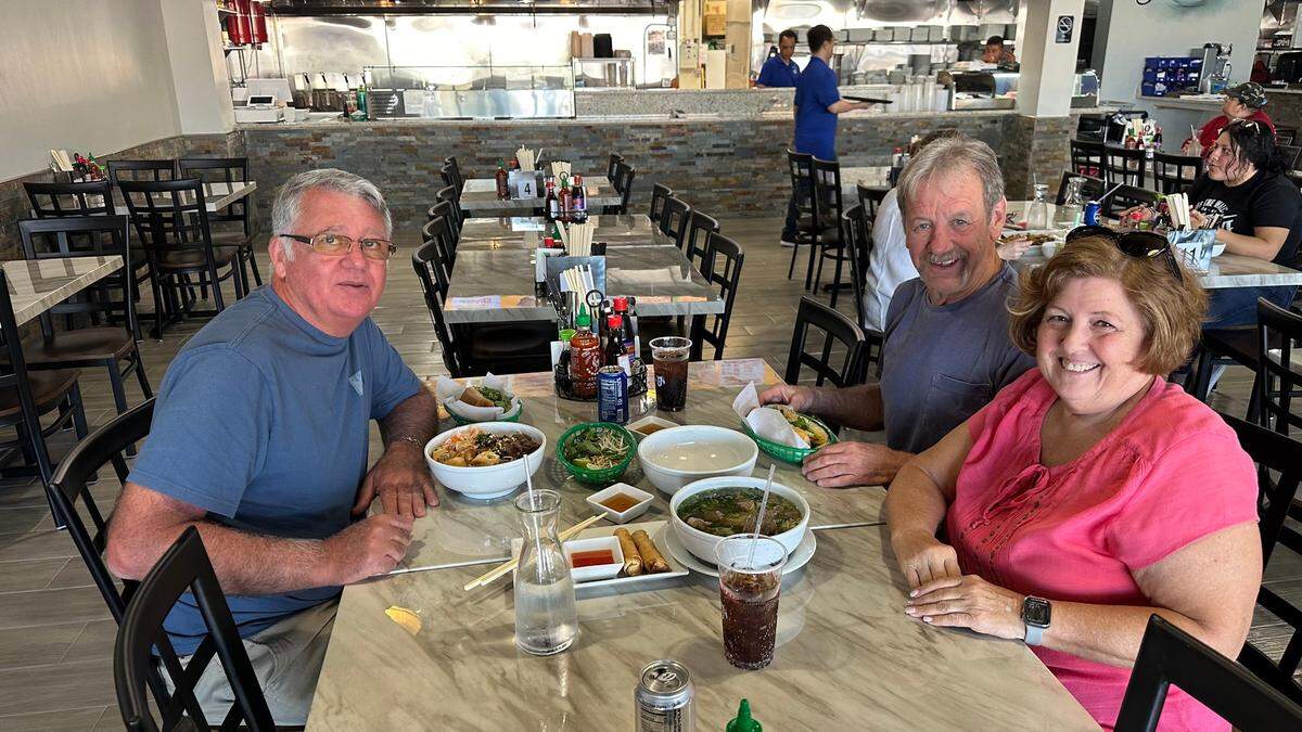 Ryan Abbott, left, and Jerry and Michelle Sandlin prepare to have lunch at Food Hall, 465 Cortez Road W., Bradenton.