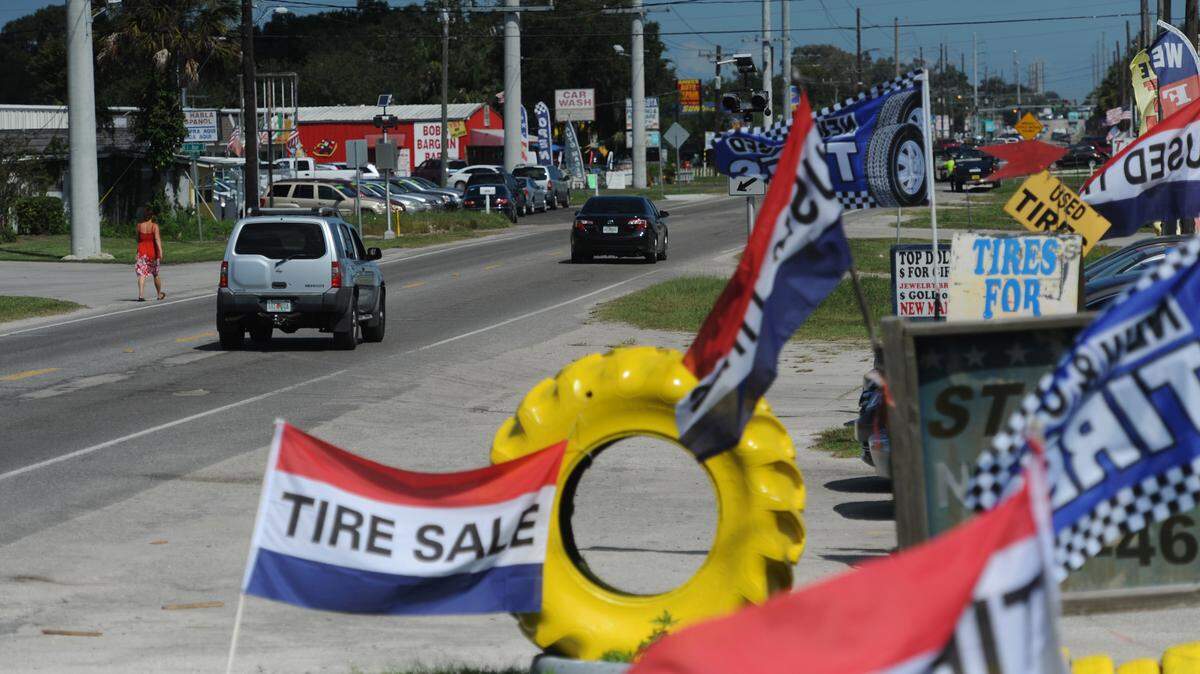 A colorful view of 15th Street East, looking north from the 5500 block, as businesses display flags and signs along the worn two-lane road. Florida Department of Transportation is looking to make multi-model improvements to the 15th Street East corridor.GRANT JEFFERIES/Bradenton Herald