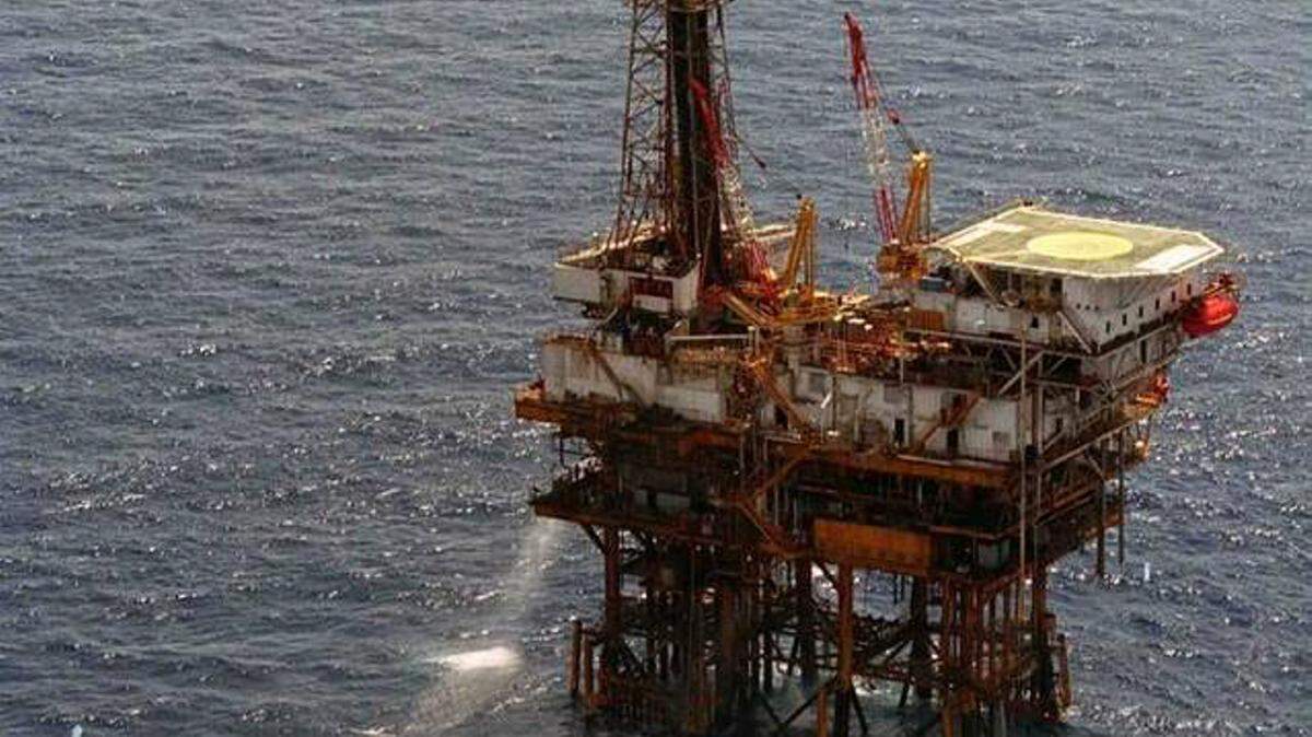 In this undated photo, a boat nears an offshore oil rig in the Gulf of Mexico. The Obama administration announced plans Thursday to open 45 million additional acres of offshore Gulf waters for oil and gas development and exploration. 
 ASSOCIATED PRESS