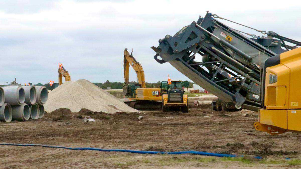 An apron is under construction on the east side of Sarasota Bradenton International Airport, shown Nov. 22, 2022, to serve a planned ground-level terminal and provide parking for three airliners.