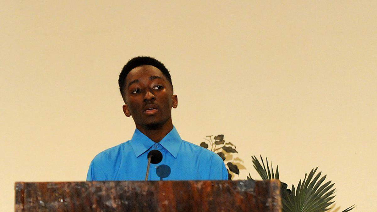 Tyrese Galloway, a student at State College of Florida's collegiate school, presents his winning essay for high schoolers Thursday night at the Palmetto Youth Center during the Martin Luther King Jr. Essay and Speech competition.TIFFANY TOMPKINS-CONDIE/Bradenton Herald