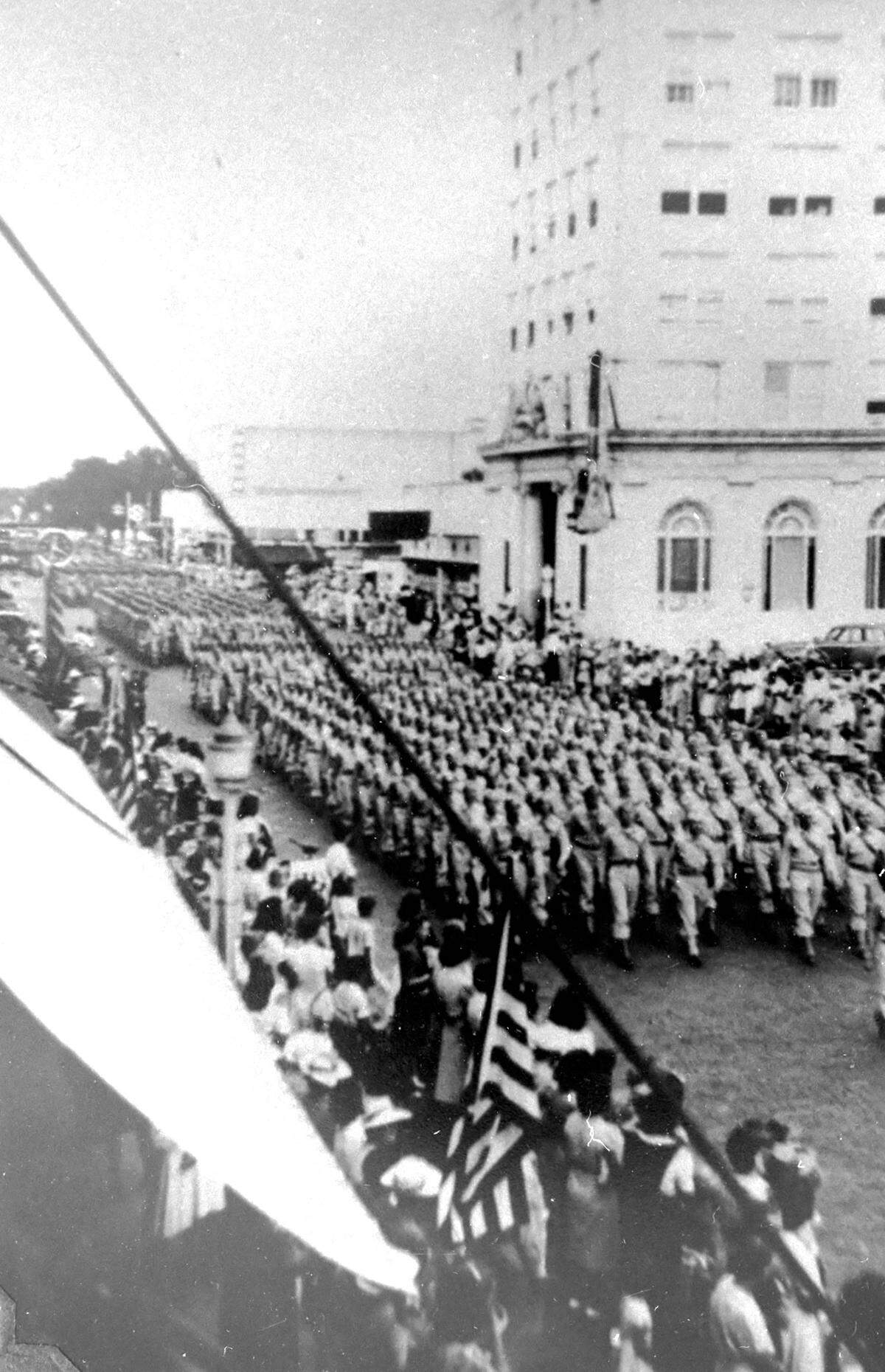 720 Signal Aircraft Warning Battalion, stationed at Camp Weatherford, during a dress parade in downtown Bradenton during WWII.