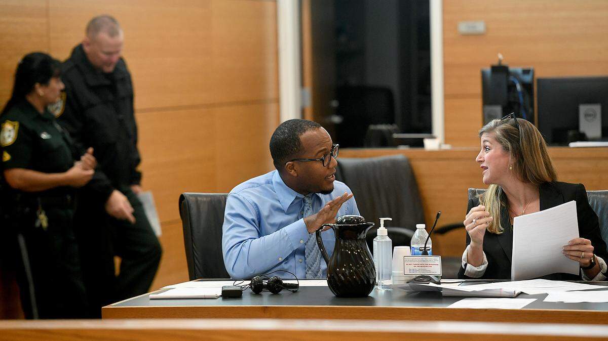 07/21/21—Quentin Peterson consults with his attorney, Kaitlyn Statile, before jury selection. Peterson, 28, is charged with two counts of possession of child pornography. If convicted as charged, Peterson faces up to 10 years in prison.