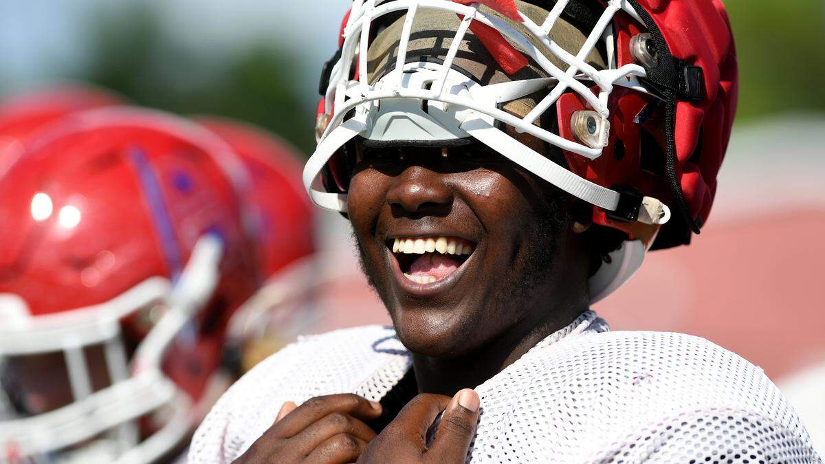 Manatee High’s Ean Johnson-Kelly breaks into a laugh during a break in practice at on Wednesday, Sept. 21, 2022.