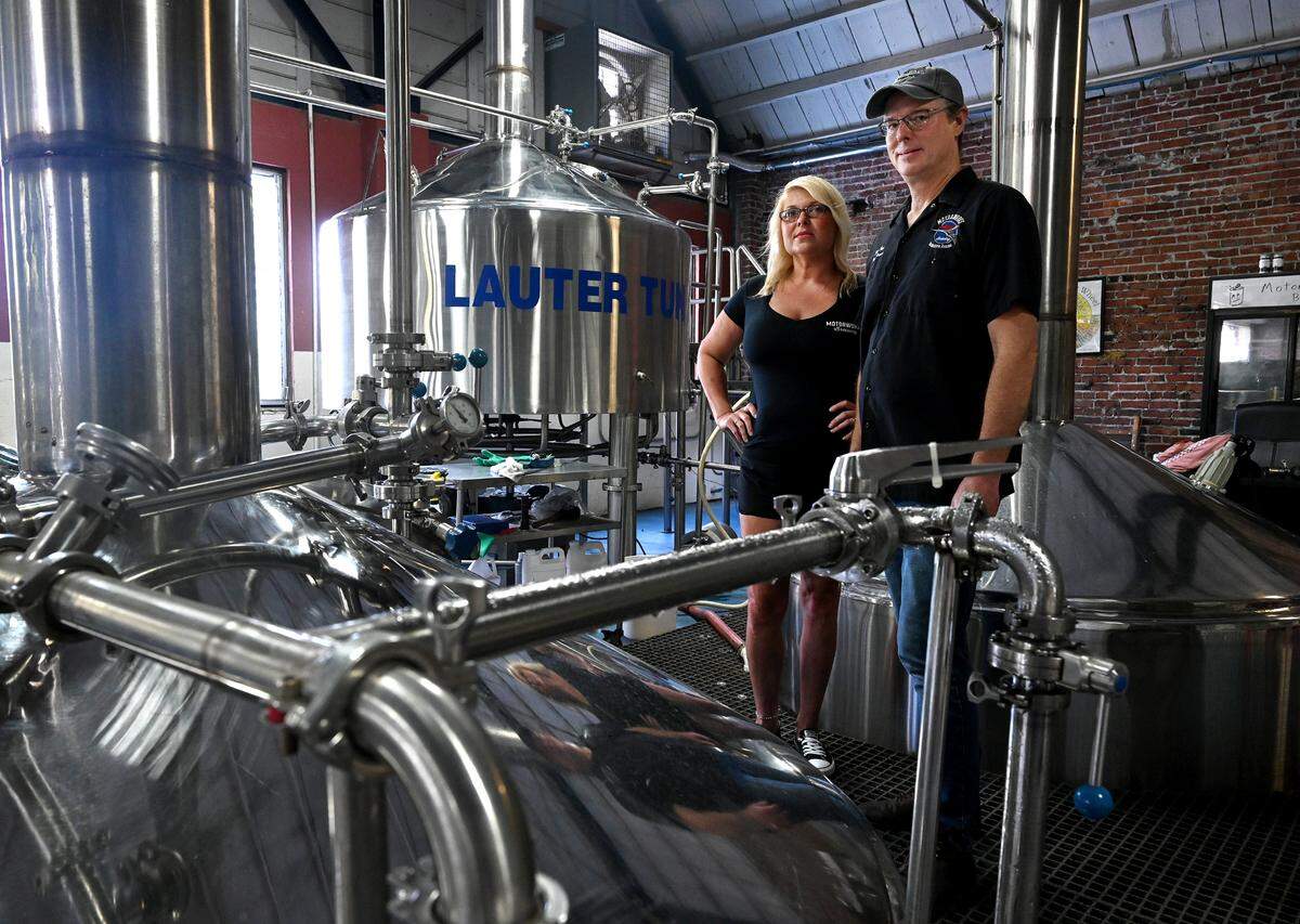 Desiree Chubb, director of quality and production at Motorworks Brewing in Bradenton, with Bob Haa, head brewer, have brewed a new beer using Florida hops.