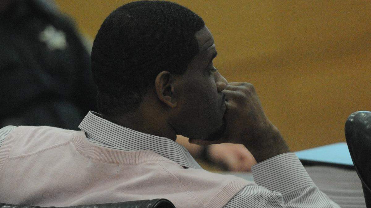 Everrick Houston listens to testimony during his trial Wednesday. Houston, 34, is charged with two counts of first-degree murder and one count armed burglary.GRANT JEFFERIES/Bradenton Herald