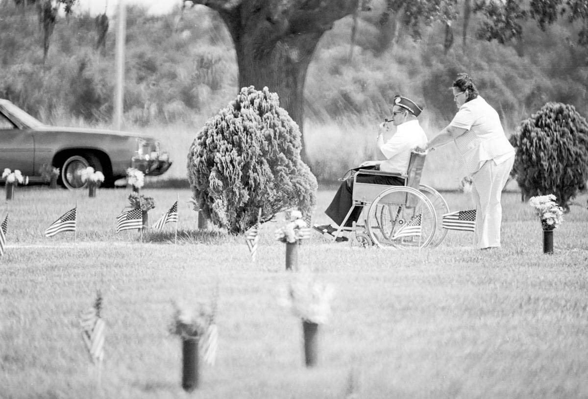 A veteran at a graveside Memorial Day Services in 1978.