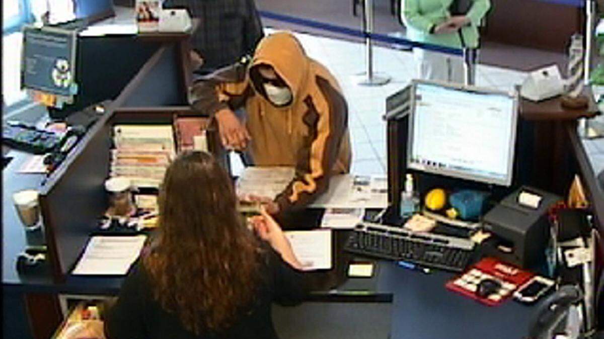 A photograph taken from from surveillance footage of a bank robbery suspect in Bradenton Friday, according to the Bradenton Police Department. 
 PHOTO PROVIDED