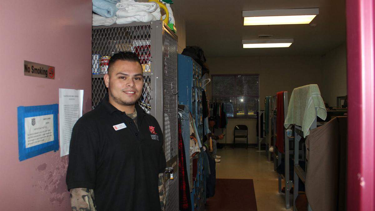 Tony Rivera, housing monitor at the Salvation Army, opens one of the Salvation Army's dorms on 14th Street in Bradenton on Tuesday evening. 
 JAMES A. JONES JR./Bradenton Herald