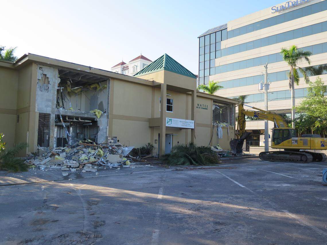 Demolition began Wednesday morning on the former downtown site of the Manatee Chamber of Commerce. Crews are making way for the new City Centre parking garage.
