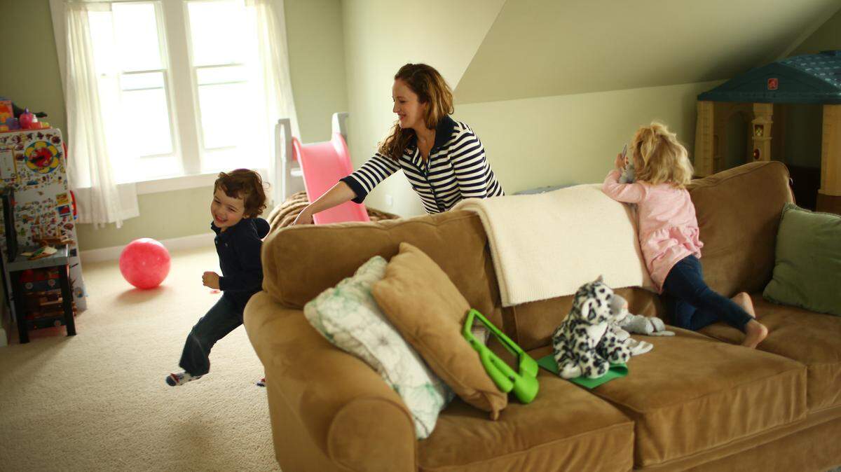 Phoebe Elder, who worked at Google for nine years, plays last month with her children Jacob, 4, left, and Hannah, 2, at their Glenview, Ill., home in suburban Chicago. "I'm not looking to fully return to the workforce at this moment, but I would love the opportunity to do something to stay relevant," said Elder, 34, who has signed up to be part of The Mom Project's talent network. CHRIS WALKER/Chicago Tribune/TNS