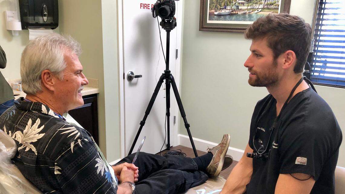 Dr. Ryan Rubino visits with Tim Munford, a disabled Bradenton veteran, after installing his new new dental implants on Friday. The smile makeover, valued at $50,000, was a gift from Rubino Periodontics and Implant Dentistry.