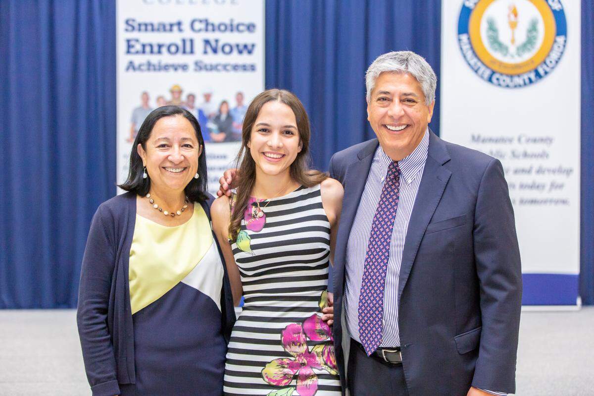 UnidosNow Executive Director Luz Corcuera, left, and Hector Tejeda, UnidosNow advisor for Education Initiatives, right, stand with a student in the program. Corcuera said Hector is “one of those people born every 100 years.”