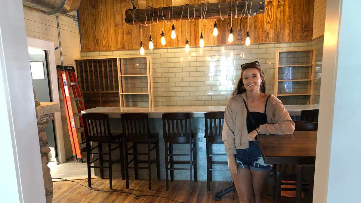 4/15/2021--Brianna Foster stands in the bar of The Porch restaurant, 9707 Gulf Drive, Anna Maria, which is expected to open in about one month.