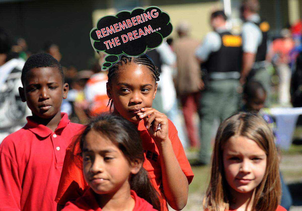 A girl wears a headpiece with the words "remembering the dream" during a past Martin Luther King Jr. Parade in Palmetto.