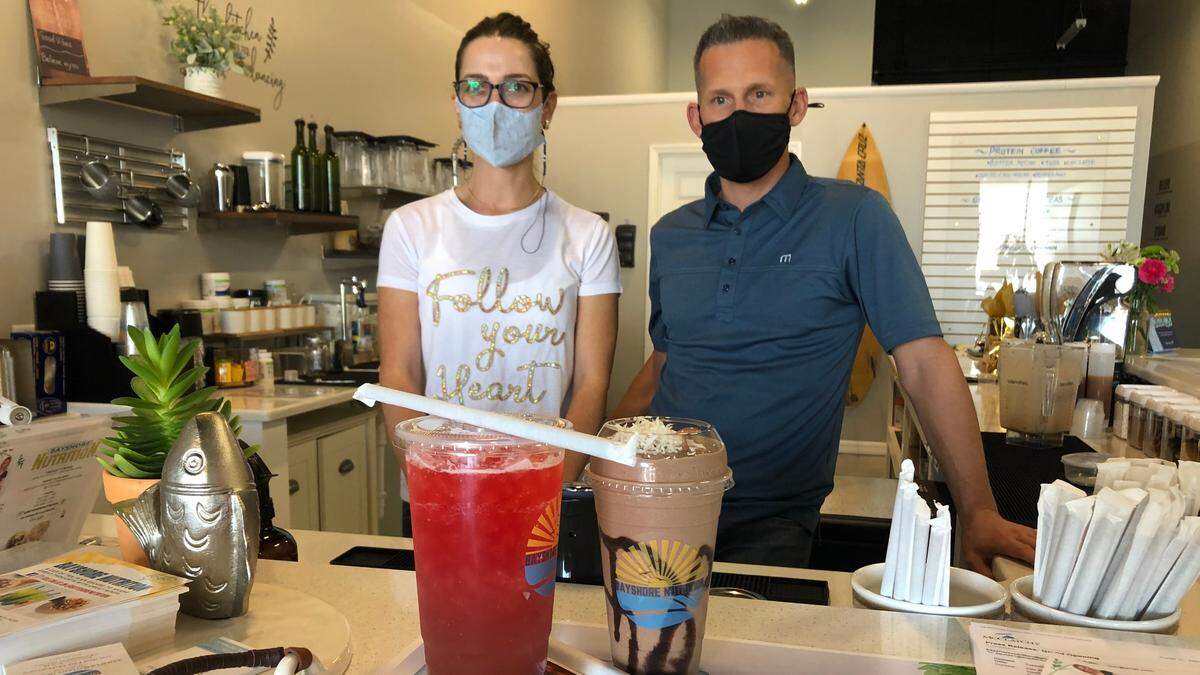 Feliz and Joseph McNamara serve up a Berry Blast tea and a Chocolate Lovers shake at their newly opened Bayshore Nutrition business at 5330 34th St. W.