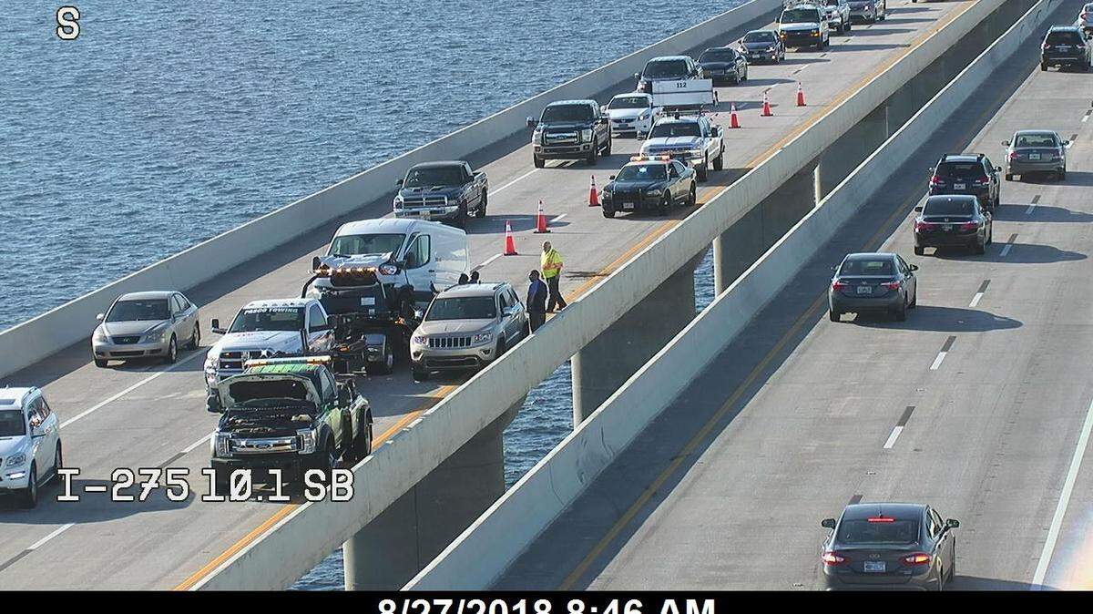 Traffic camera on the Sunshine Skyway Bridge over Tampa Bay shows a traffic crash blocking the inside northbound lane at about mile marker 10, just north of the main span of the bridge.