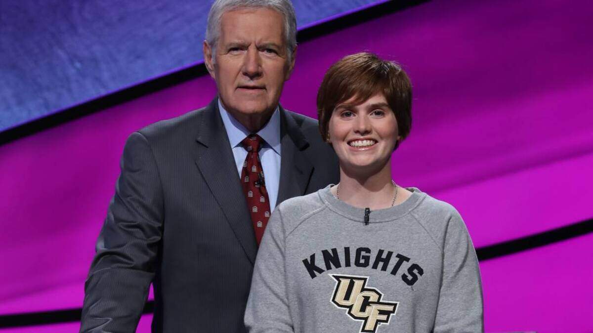 Hannah Sage, 19, stands with longtime 'Jeopardy!' host Alex Trebek. Sage, who grew up in Lakewood Ranch, was chosen to compete in the show's annual College Championship tournament.